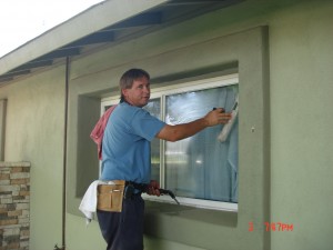 window washer demonstrating window washing technique in Phoenix